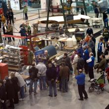 Second-floor view of Museum visitors touring the Museum's restoration hangar during an open house event.