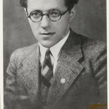 Willy Ley, a white man, poses for a portrait. He is wearing glasses and a suit.