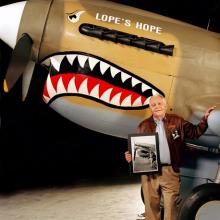 Donald Lopez with Curtiss P-40 at the Udvar-Hazy Center