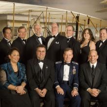 Former Museum Director Jack Dailey, Awards Master of Ceremonies David Hartman, N. Wayne Hale, Jr., and members of the STS-121 team stand together for a group photo at an awards ceremony.