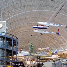 Global Flyer, a white and blue plane with very long wings, hangs on display at the Udvar-Hazy Center.