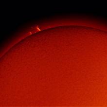 View of a prominence of plasma floating away from the Sun.