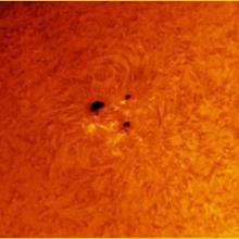 A view of three sunspots on the Sun.