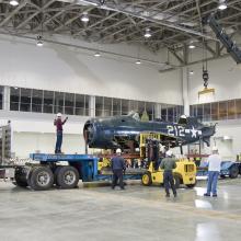 Staff Move <i>Helldiver</i> into Mary Baker Engen Restoration Hangar