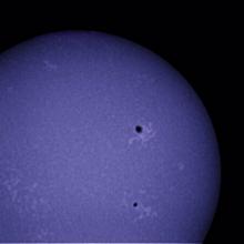 View of the chromosphere of the sun with an emphasis on multiple sunspots.