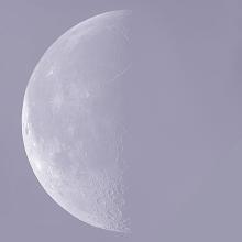 Image of the Moon in its last quarter phase during daytime hours.