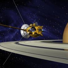 An artist's vision of the Cassini spacecraft, a yellow and white spacecraft with long probes, prepares to enter Saturn's orbit.