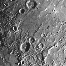 A section of Mercury with many craters on the surface.