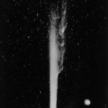 Comet Halley soars above the night sky, leaving a meteor trail behind.