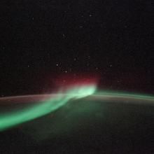 A view of the Aurora Australis, a phenomeon known as "southern lights", from the Space Shuttle Discovery above Earth.