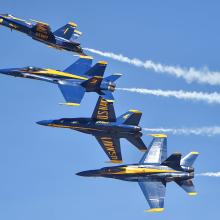 Blue Angels F/A-18C Hornets flying in formation during an airshow