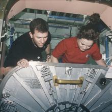 STS-96 Astronauts Adjust ISS Unity Hatch