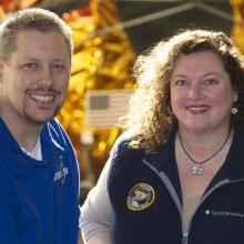 Marty Kelsey, a white man, and Beth Wilson, a white woman, stand together and pose formally.