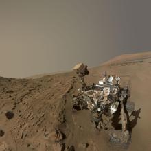 Curiosity, a Mars rover, attempts to take a self-portrait of itself as it stands on a slope section on Mars.