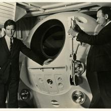 Frederick I. Ordway III (left) and Harry Lange (right) pose with an EVA Pod in the Discovery One pod bay interior set of the motion picture 2001: A Space Odyssey 