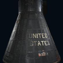 Gemini capsule with the words United States on the outside.