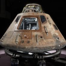 Picture of Apollo 11 Command Module on display.