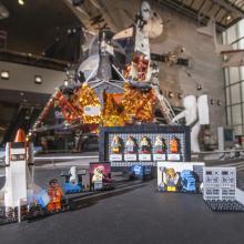 The original prototypes of the  LEGO® Ideas "Women of NASA" set displayed in front of the Apollo Lunar Module in the Boeing Milestones of Flight Hall