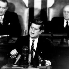 John F. Kennedy speaks to Congress during a speech announcing his plans to put Americans on the moon.