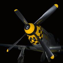 Four-blade propellers on nose of gray and yellow checkered P-51 Mustang aircraft