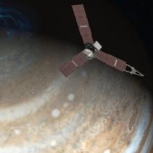 A rendering of the spacecraft Juno with Jupiter in the background. 