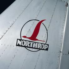 "Northrop" logo with red bird in circle on tail of metal Northrop Gamma Polar Star aircraft