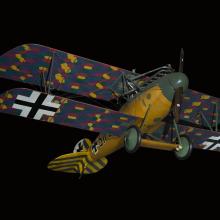 Biplane with multi-color, camouflaged wings, wood grain finish fuselage, and green and yellow details on tail and nose, seen from below