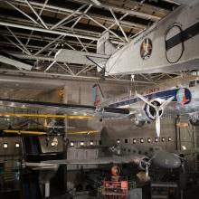 Twin-engined Douglas DC-3 aircraft hanging in museum