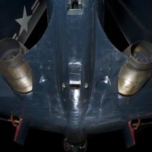 Bottom of blue McDonnell FH-1 Phantom I aircraft with two round engines attached to each wing