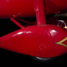 Red teardrop shaped wheel faring on Amelia Earhart Lockheed Vega 5B aircraft