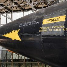 Yellow rescue label and yellow spear detail on nose of black titanium North American x-15 aircraft