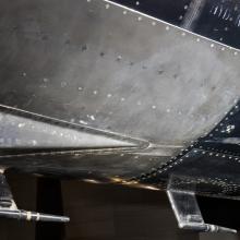 Metal plated vent on bottom of black titanium North American X-15 aircraft