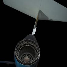 Closeup view of Lockheed F-104A Starfighter aircraft rear exhaust port with tail