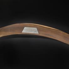 Wooden Apollo 11 Commemorative Boomerang with label on apex