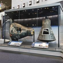 Mercury Friendship 7 and Gemini IV on display in the Boeing Milestones of Flight Hall