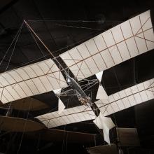 Canvas and wood Langley Aerodrome Number 5 aircraft hanging in museum