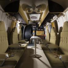 interior view of the Mobile Quarantine Facility, which includes six seats, six bunks, kitchen and bathroom.