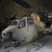 Front of Bell AH-1F Cobra helicopter in museum