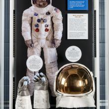 Wide view of Neil Armstrong's Apollo 11 gloves and helmet on display