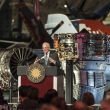 Gen. J. R. "Jack" Dailey, a white male who was formerly Director of the Museum, speaks to guests during an anniversary celebration of the Museum's Steven F. Udvar-Hazy Center.