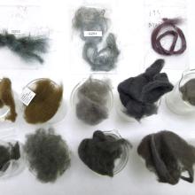 13 wool fiber samples of various colors