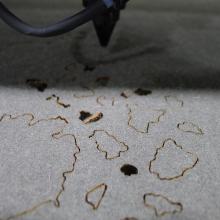 close-up view of fabric being cut with laser cutting