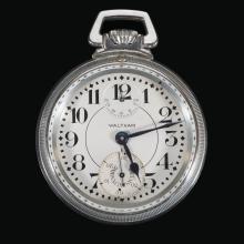 Silver torpedo boat watch with black hands at 5:12. Inset dial on watch at the 12 reads "DN 24 18 12 6 0 UP" Dial on watch at the 6 with markings 10 20 30 40 (hidden) 50 60