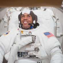 NASA astronaut Alvin Drew, STS-133 mission specialist, participates in an Extravehicular Mobility Unit (EMU) spacesuit fit check.