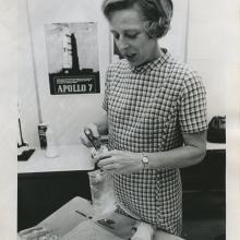 Rita Rapp carefully stows a bag of frankfurters besides labeled meal packages.