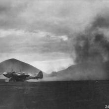 A U.S.-built Martin 167 kicks up dust during takeoff on Ascension Island