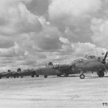 B-24s, B-25s, and B-26s sit on the ramp at Val De Case Airfield