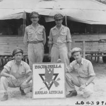 A Flight of 201 Squadron “Aztec Eagles” pose in front of their logo