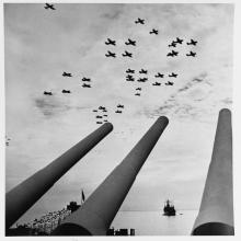 Carrier airplanes seen over the USS Missouri’s guns