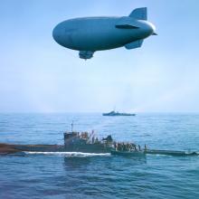 K-ship flies over surfaced U-Boat